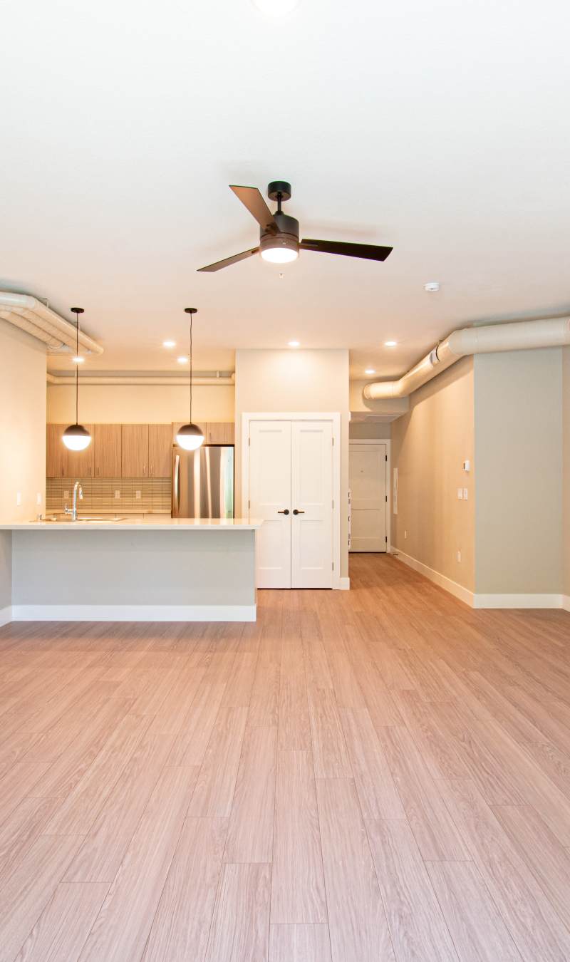 Beautiful apartment with wood-style flooring at Stone Village Apartments in Reno, Nevada