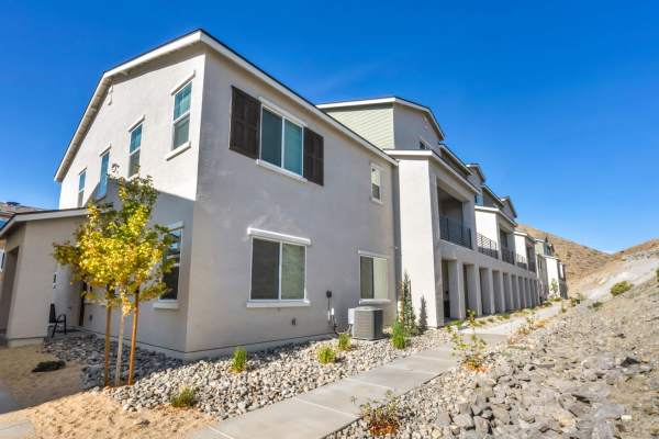 A residential house with a gravel path and a driveway in front at Prosper 83 in Sparks, Nevada