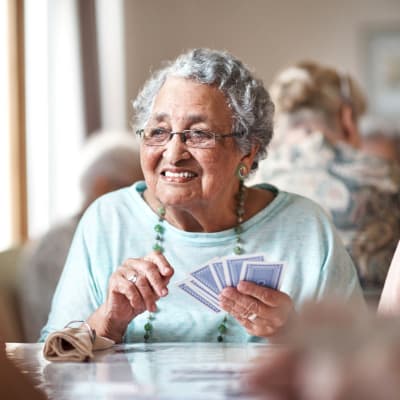 Residents playing cards at Retirement Center Management in Houston, Texas