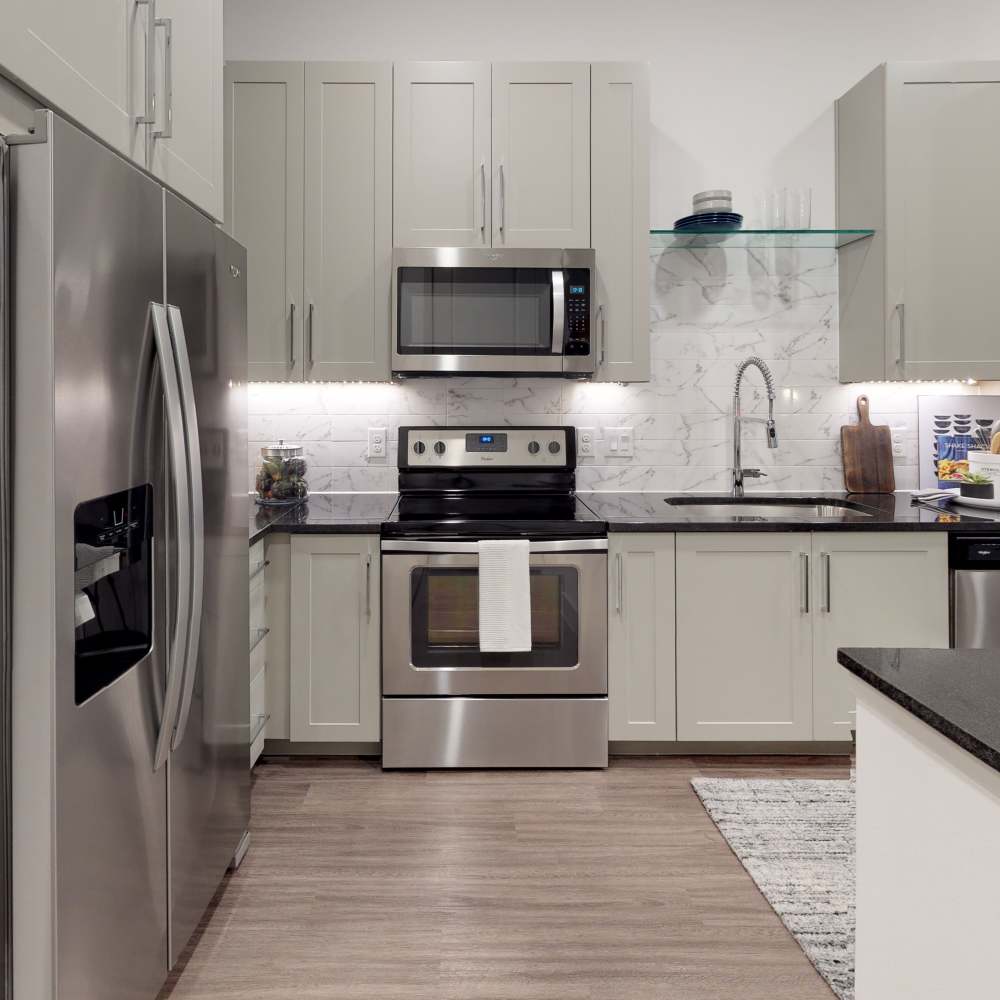 Kitchen with stainless-steel appliances at Howell Uptown in Dallas,Texas