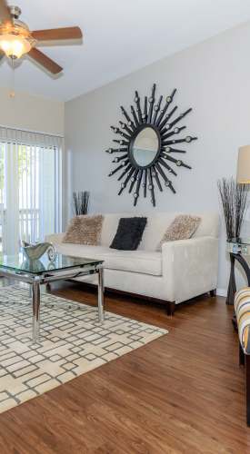 Living room with wood flooring at One Belmar Place in Lakewood,Colorado