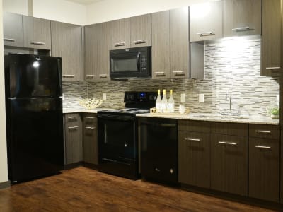 Gourmet kitchen with granite countertops at Terra at University North Park in Norman, Oklahoma