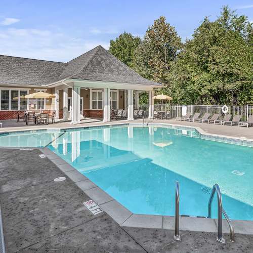 Swimming pool with lounge beds at Avalon At Sweeten Creek in Arden, North Carolina
