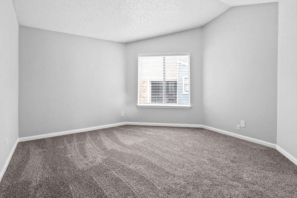 Bedroom with a window at The Azul Apartments in Dallas, Texas