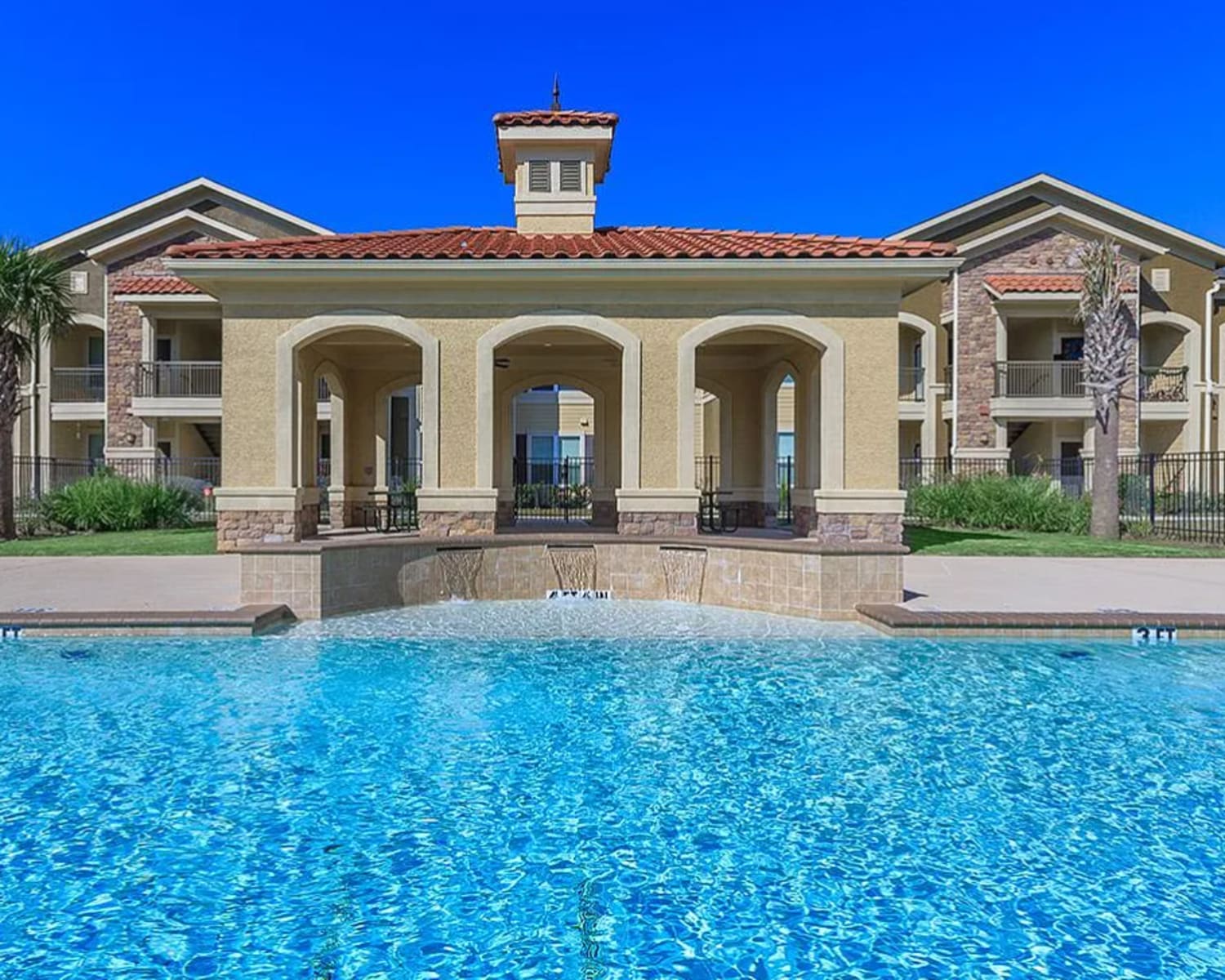 Resort-style pool at Modern apartment community at Villas On Independence in Port Lavaca, Texas