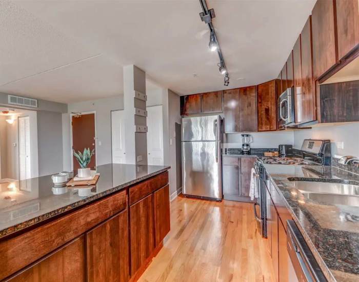 Kitchen with island and stainless-steel appliances at 21 Kristin Apartments in Schaumburg, Illinois