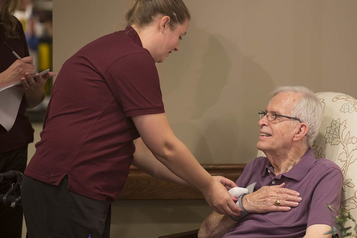 A resident and staff at The Oxford Grand Assisted Living & Memory Care in Kansas City, Missouri