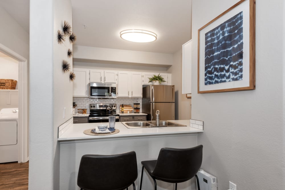 Breakfast bar in the kitchen with two bar seats at Luna at Fountain Hills in Fountain Hills, Arizona