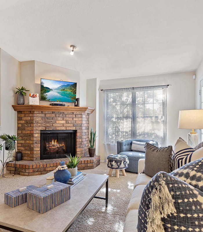 Spacious living room with large windows at Barrington Apartments in Tulsa, Oklahoma