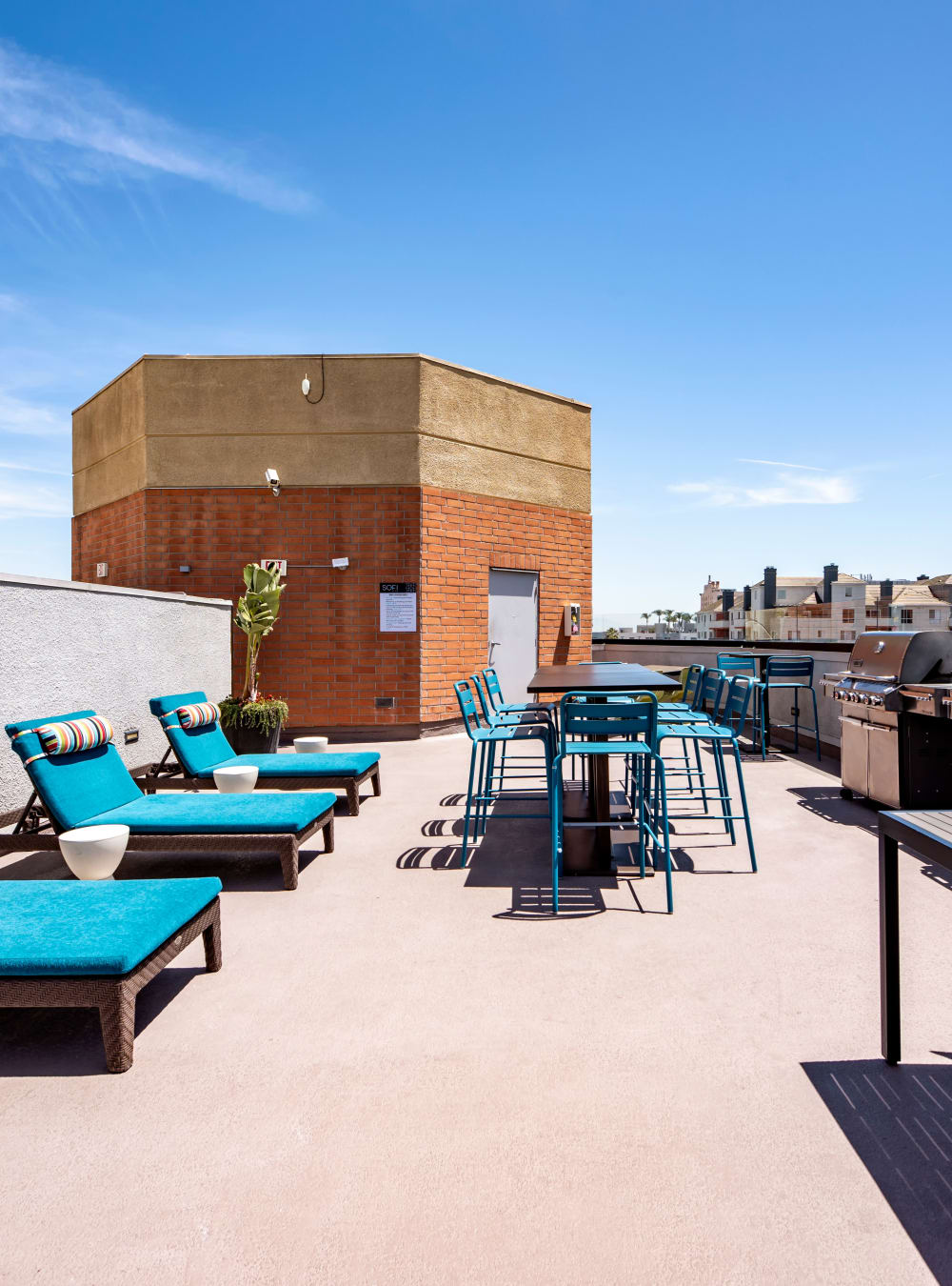 Rooftop lounge area with gas barbecue grills at Sofi at 3rd in Long Beach, California