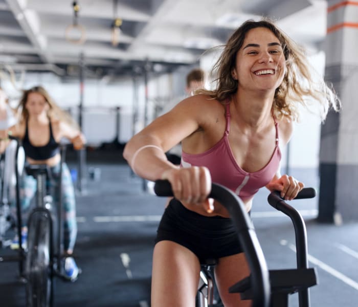 Residents in fitness center at College Town Oxford in Oxford, Mississippi