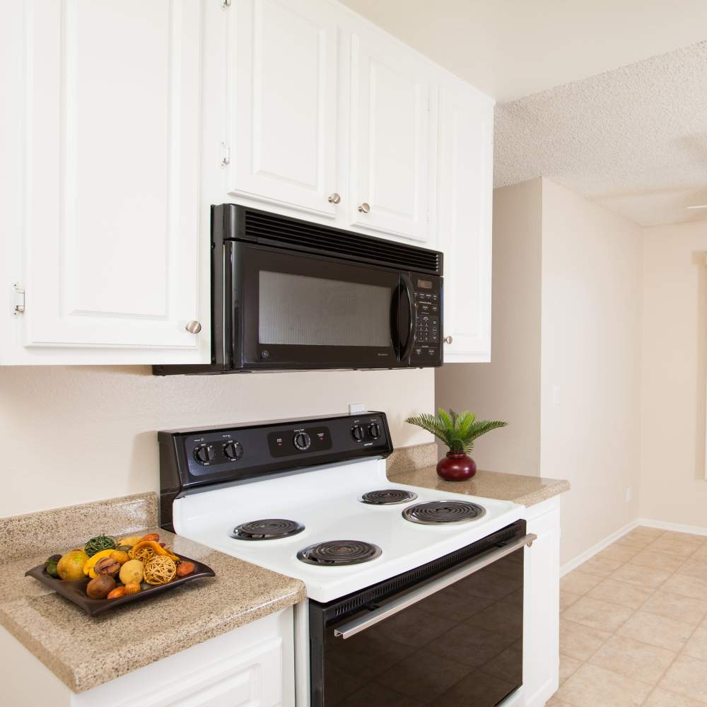 Kitchen with gas range at Forest Glen in Lake Forest,California