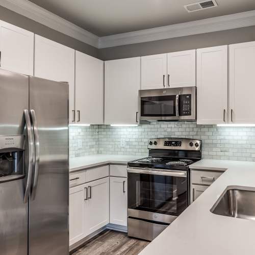 Kitchen with stainless-steel appliances at Alys in Conroe,Texas