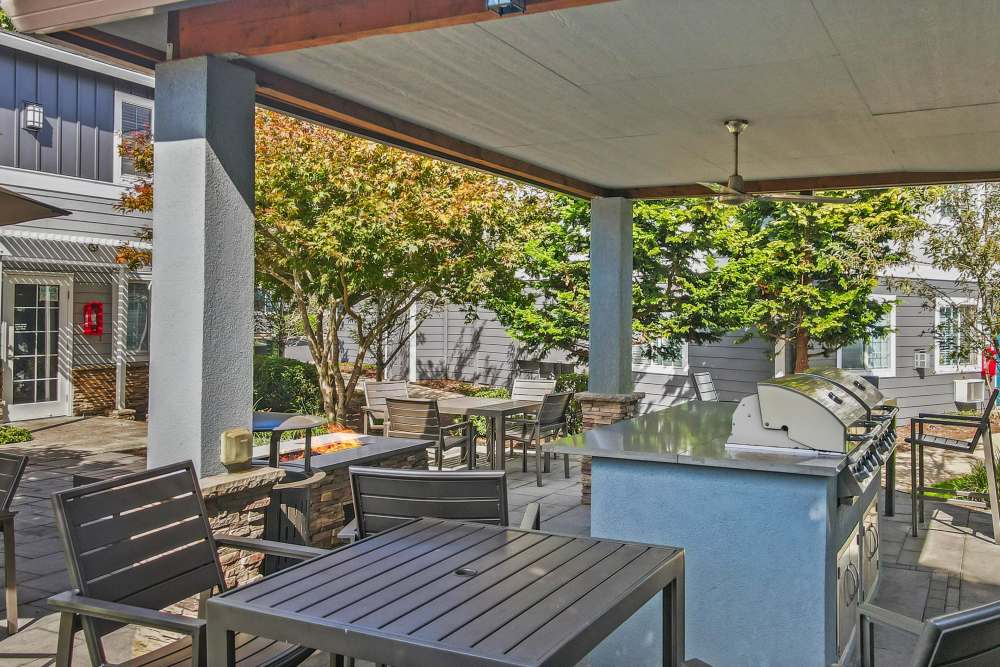 Fire pit and barbecue area at The Addison Apartments in Vancouver, Washington
