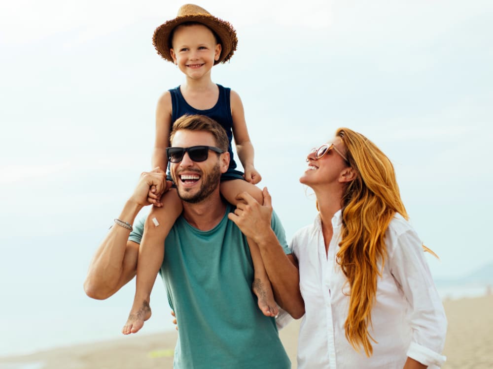 Happy family walking near Viva at New Smyrna Beach in New Smyrna Beach, Florida