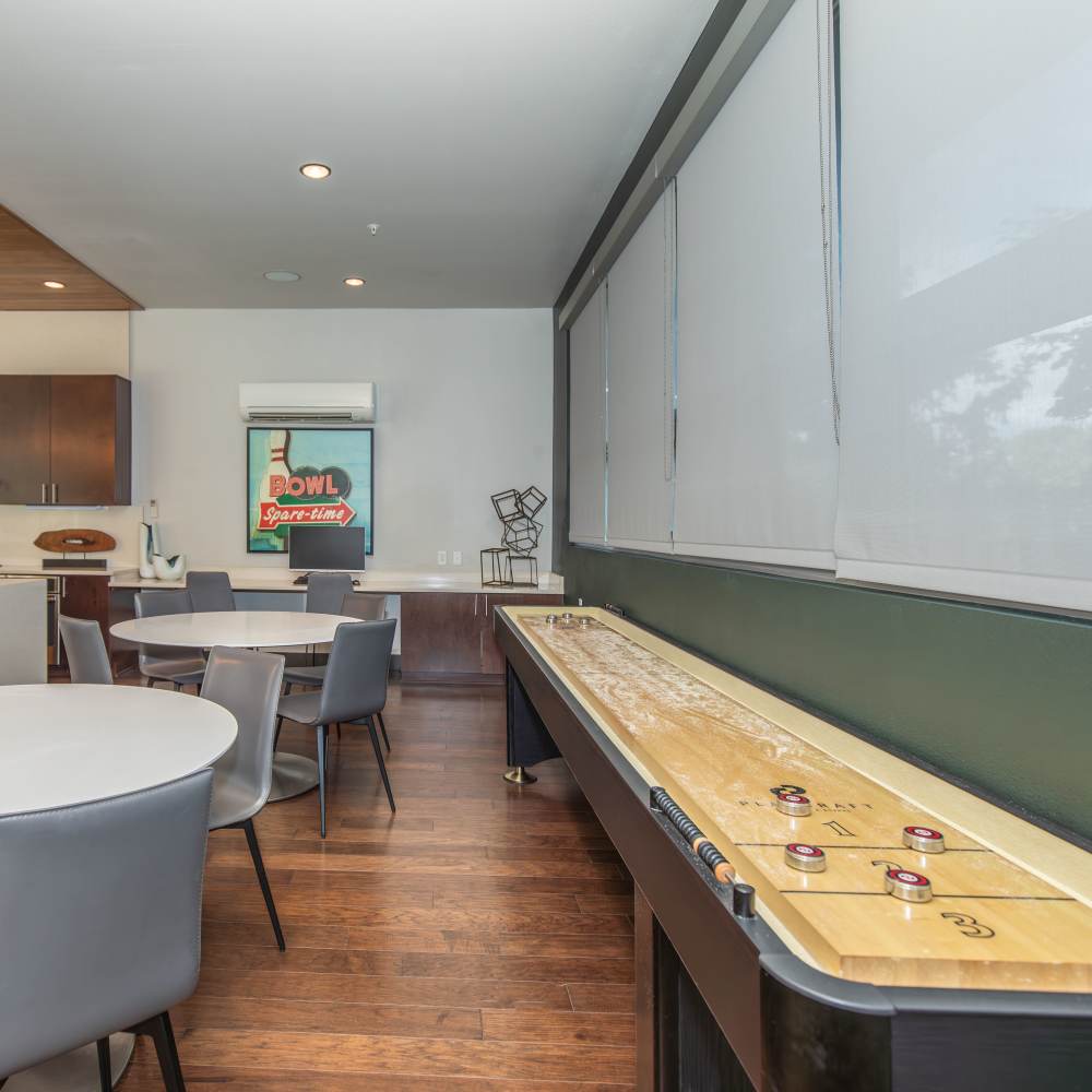 Community area with shuffleboard at Park Place Olde Town Apartments in Arvada, Colorado
