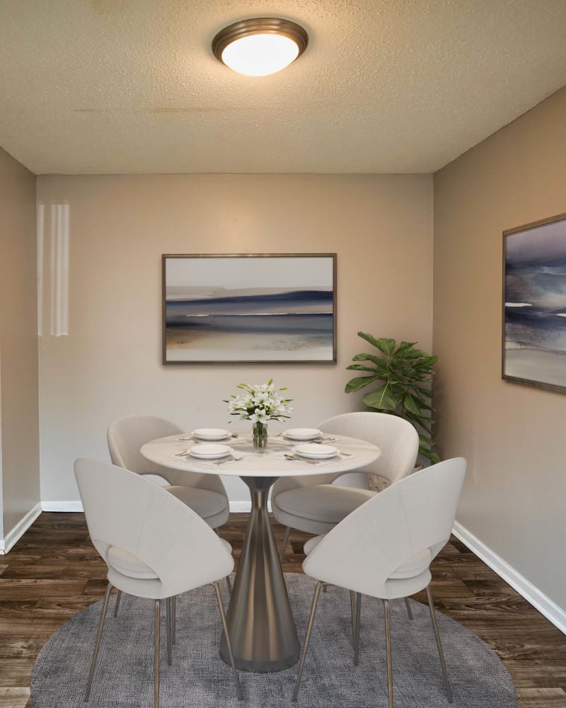 A furnished dining room in an apartment at Magnolia Manor Apartments in Center Point, Alabama