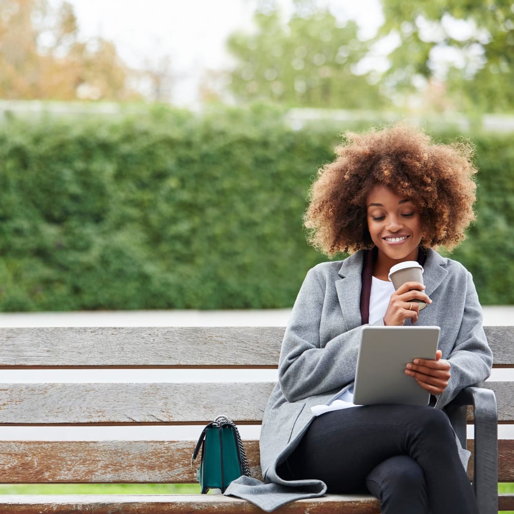 Resident connecting with us on Facebook using her tablet at Villa Del Sol in Sunnyvale, California