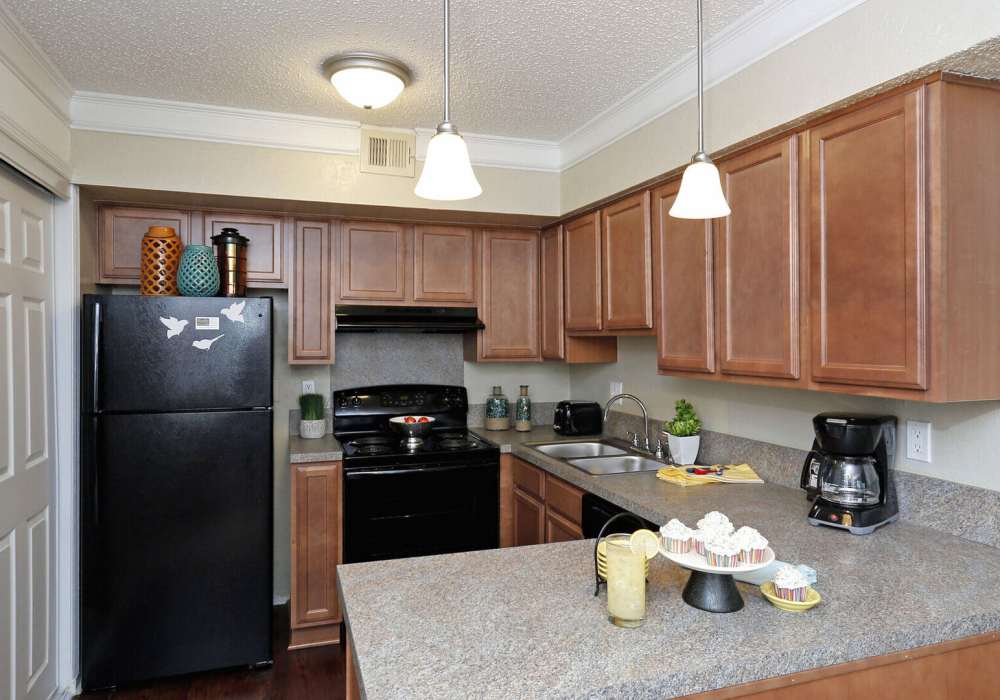 Kitchen with black appliances at Thickett in Mt Pleasant, South Carolina