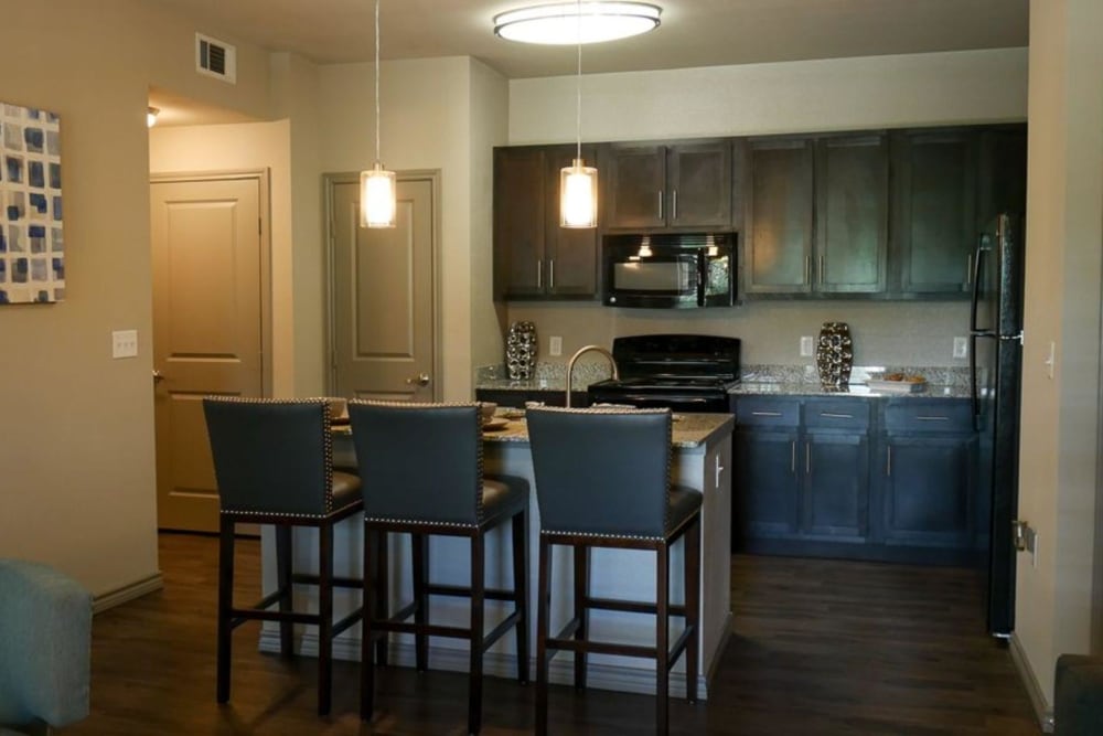 Beautiful open kitchen with island and barstool seating at The BLVD in San Angelo, Texas
