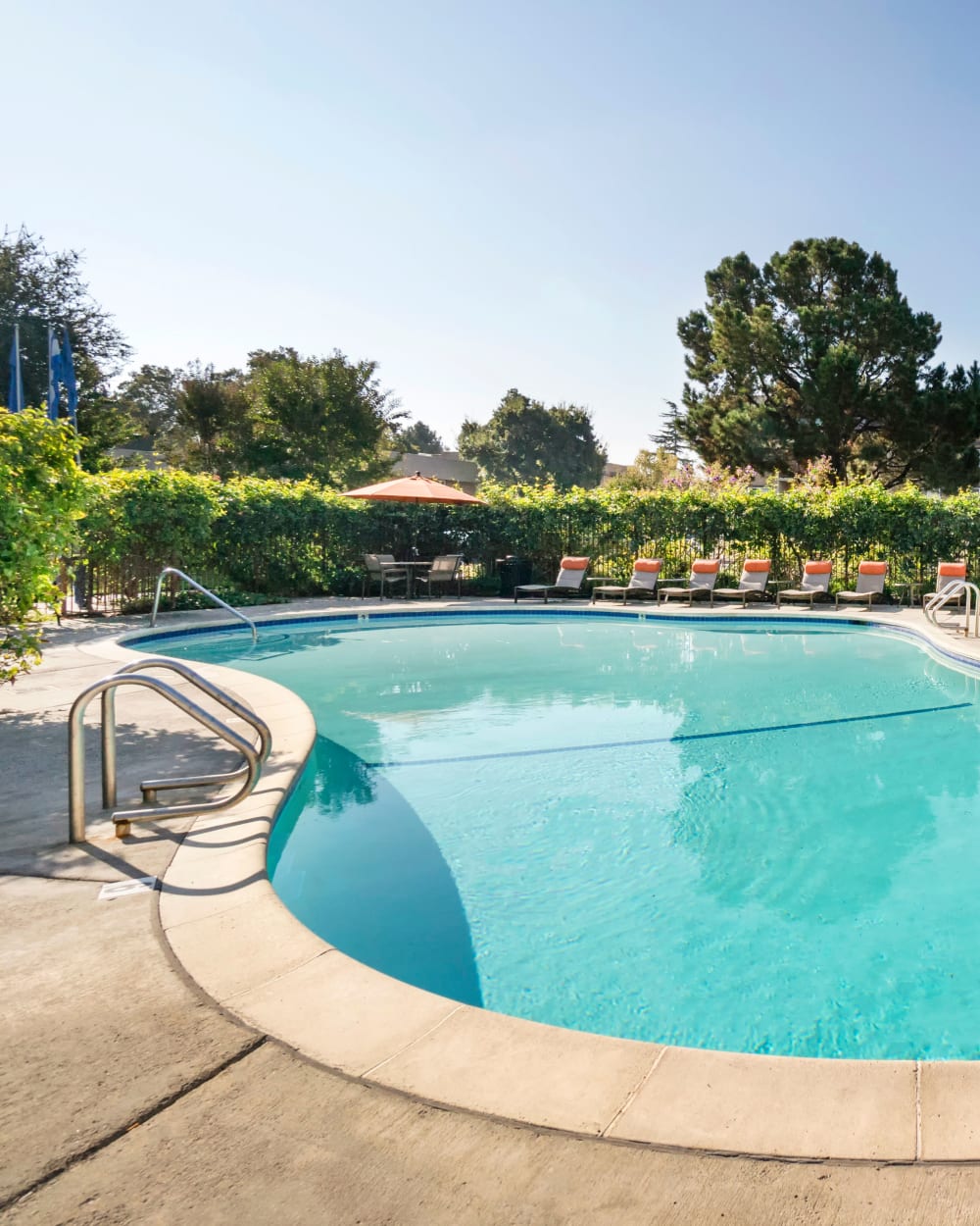 Swimming pool area on a peaceful sunny morning at Waterstone Fremont in Fremont, California