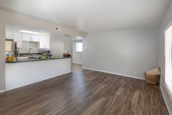 White cabinet renovation with stainless steel appliances at Windgate Apartments in Bountiful, Utah