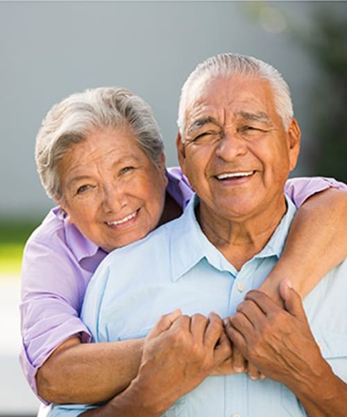 Resident couple hugging at Regency Village at Prineville in Prineville, Oregon