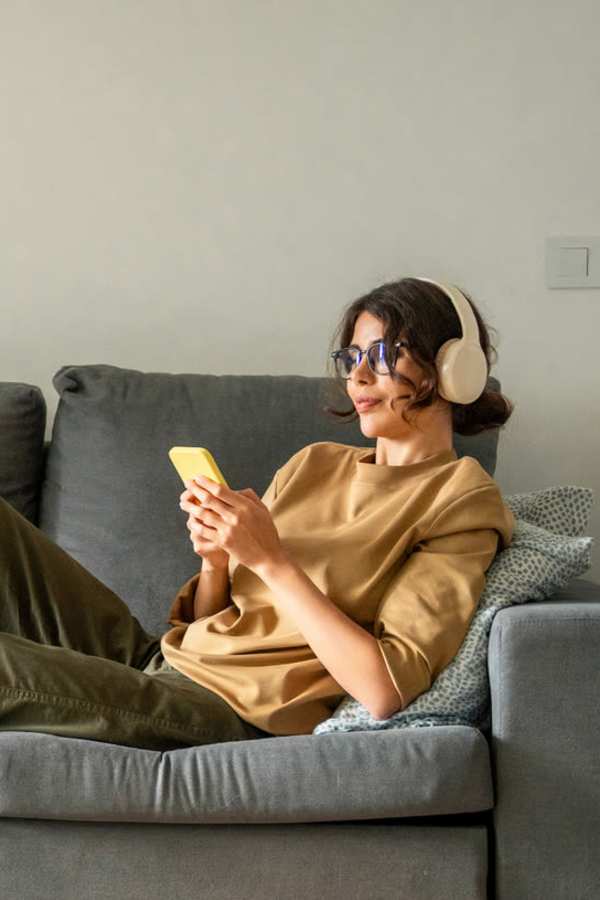 Resident listening to headphones at Centra At North Druid Hills in Atlanta, Georgia