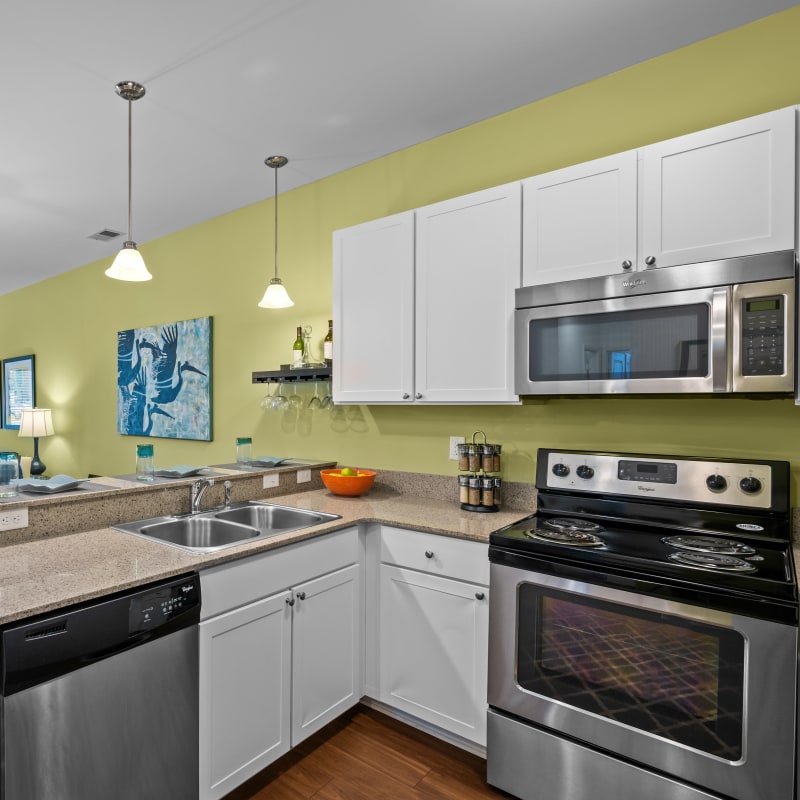 Kitchen with stainless-steel appliances at The Apartments at Spence Crossing, Virginia Beach, Virginia