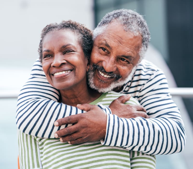 A resident couple embraces at The Sanctuary at West St. Paul in West St. Paul, Minnesota