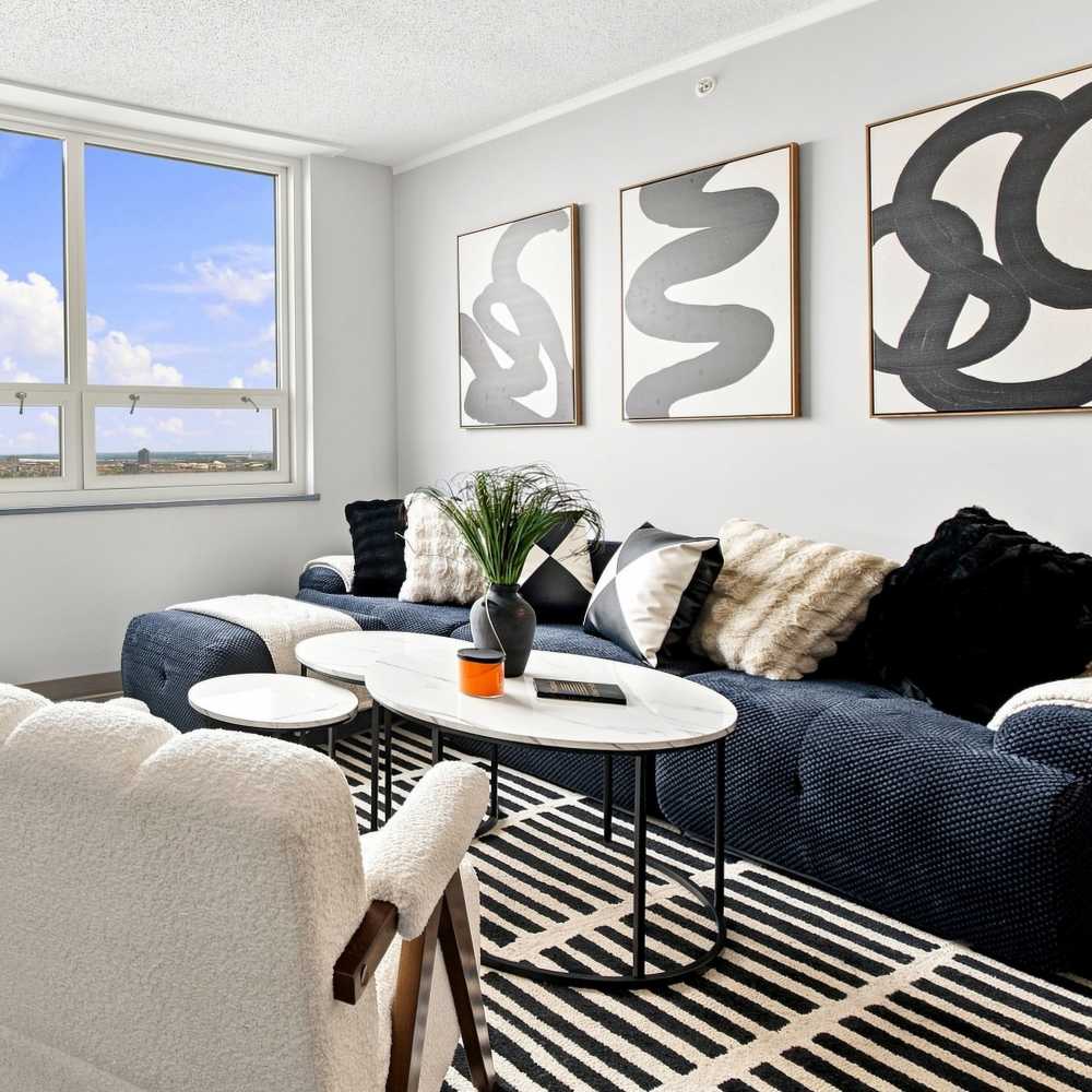 Living area with large windows at The Simone in Silver Spring, Maryland