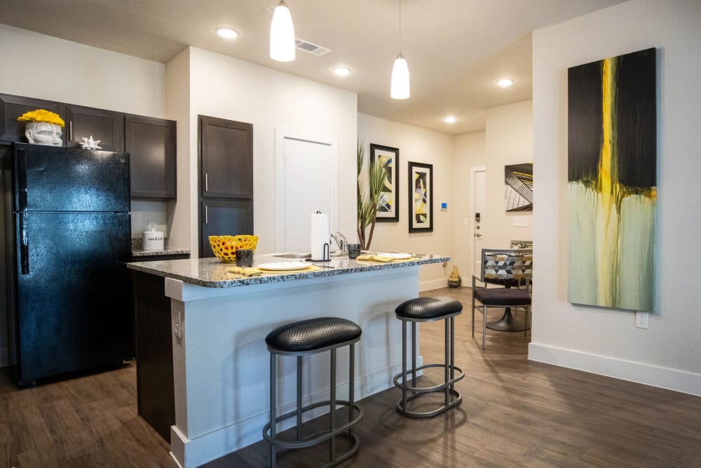 Apartment kitchen with an island at Esperanza in San Antonio, Texas