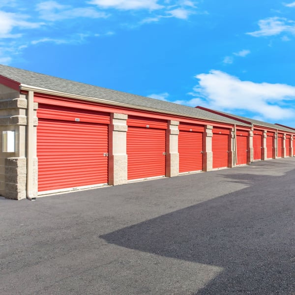 Outdoor storage units with red doors at StorQuest Self Storage in Parker, Colorado