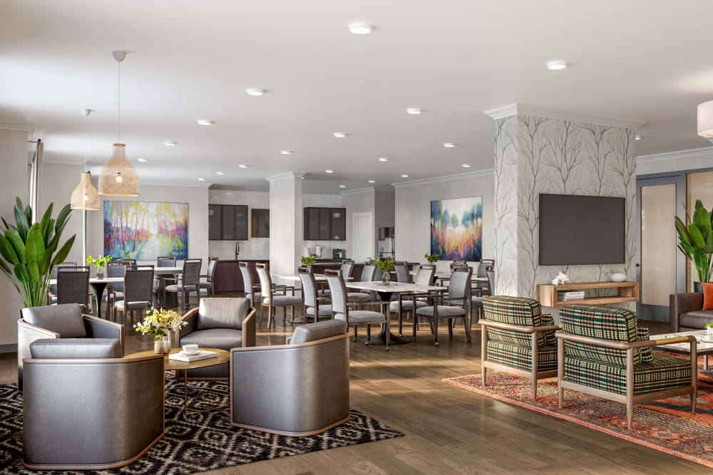 Clubhouse interior with couches at The Compass at Springdale Park in Richmond, Virginia