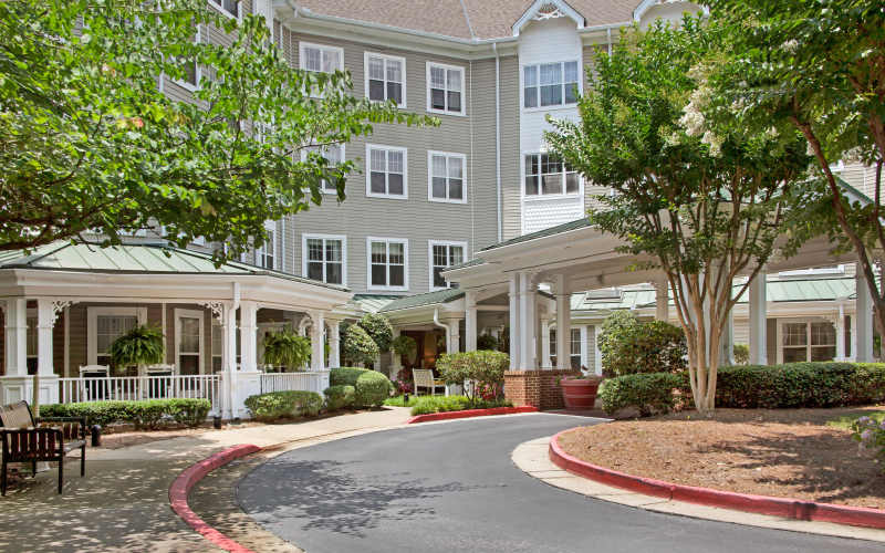 Apartment view with walking path of Glenncrest at Decatur in Decatur, Georgia