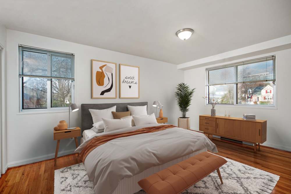 Bedroom with large comfortable and window at Bradley View Apartments in Chevy Chase, Maryland