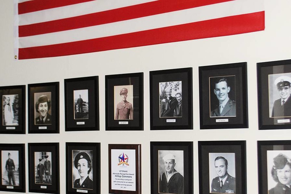 Wall of Veterans photos at Hilltop Commons Senior Living in Grass Valley, California