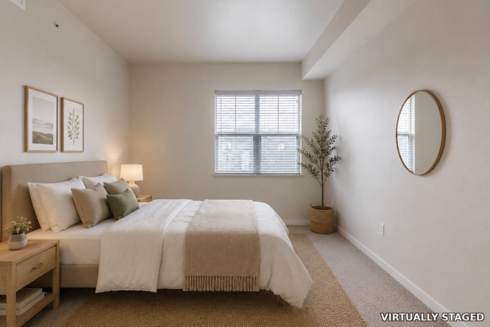 Room with carpeted flooring with a large window at The Greens at Van de Water in Loveland, Colorado  