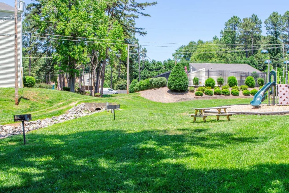 A picnic table by the playground at Georgetowne Woods in Gastonia, North Carolina