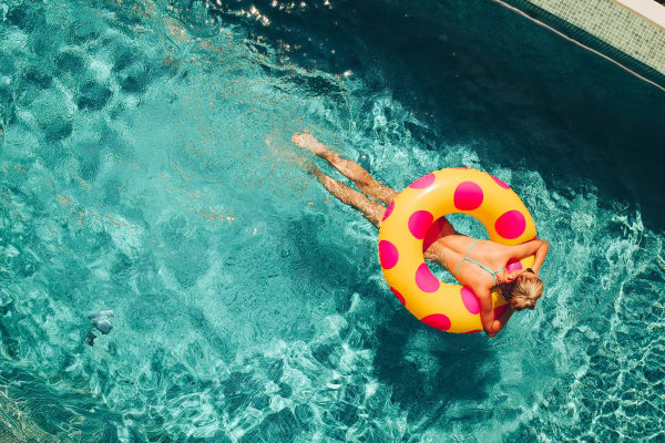 Floating in a swimming pool at Hamlet at MidCity in Huntsville, Alabama