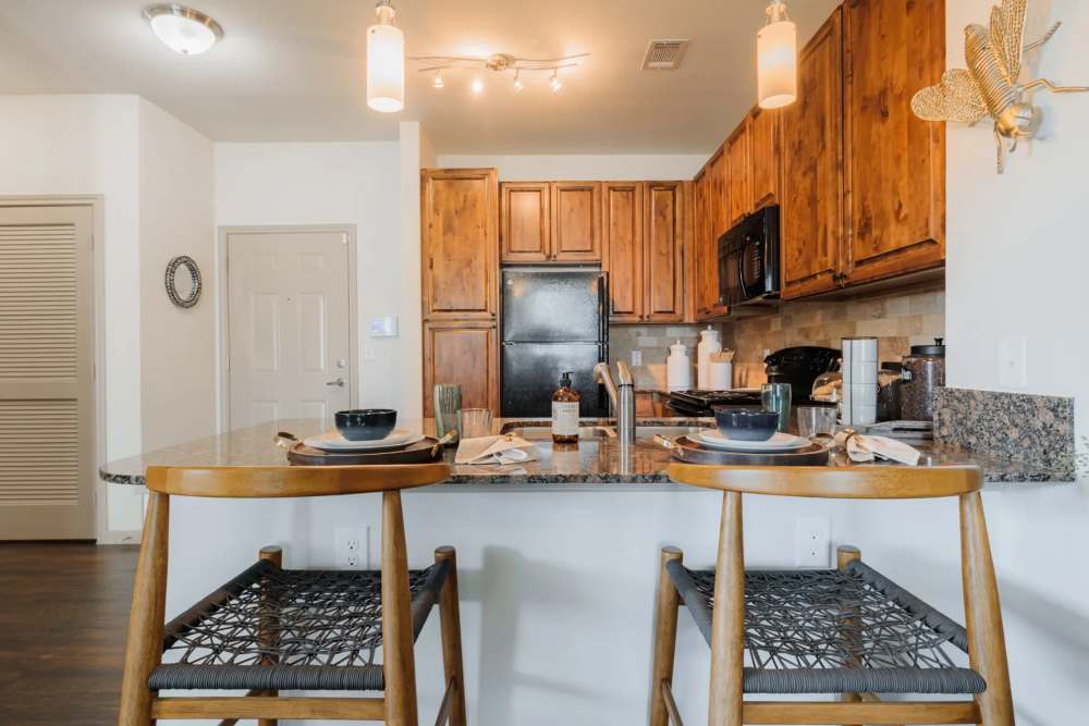 Apartment kitchen at The Pines at Woodcreek in Humble, Texas