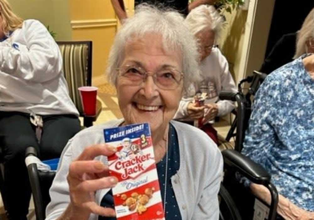 Resident holding Cracker Jacks at Truewood by Merrill, Keller in Keller, Texas