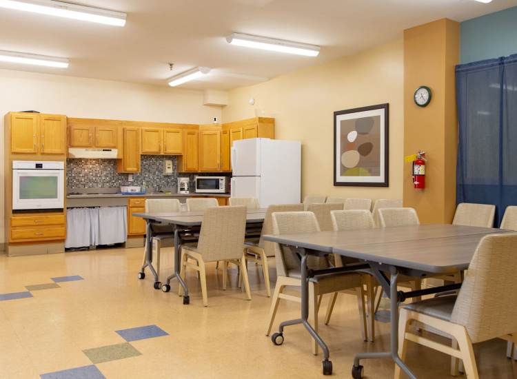 Community gathering space with kitchen at Bedford Towers in New Bedford, Massachusetts