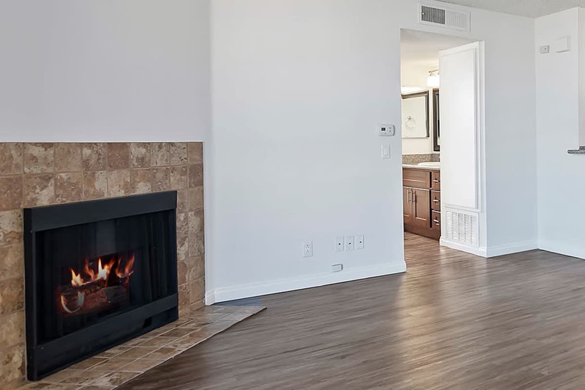 Open floor plan with a fireplace at The Jessica Apartments in Los Angeles, California