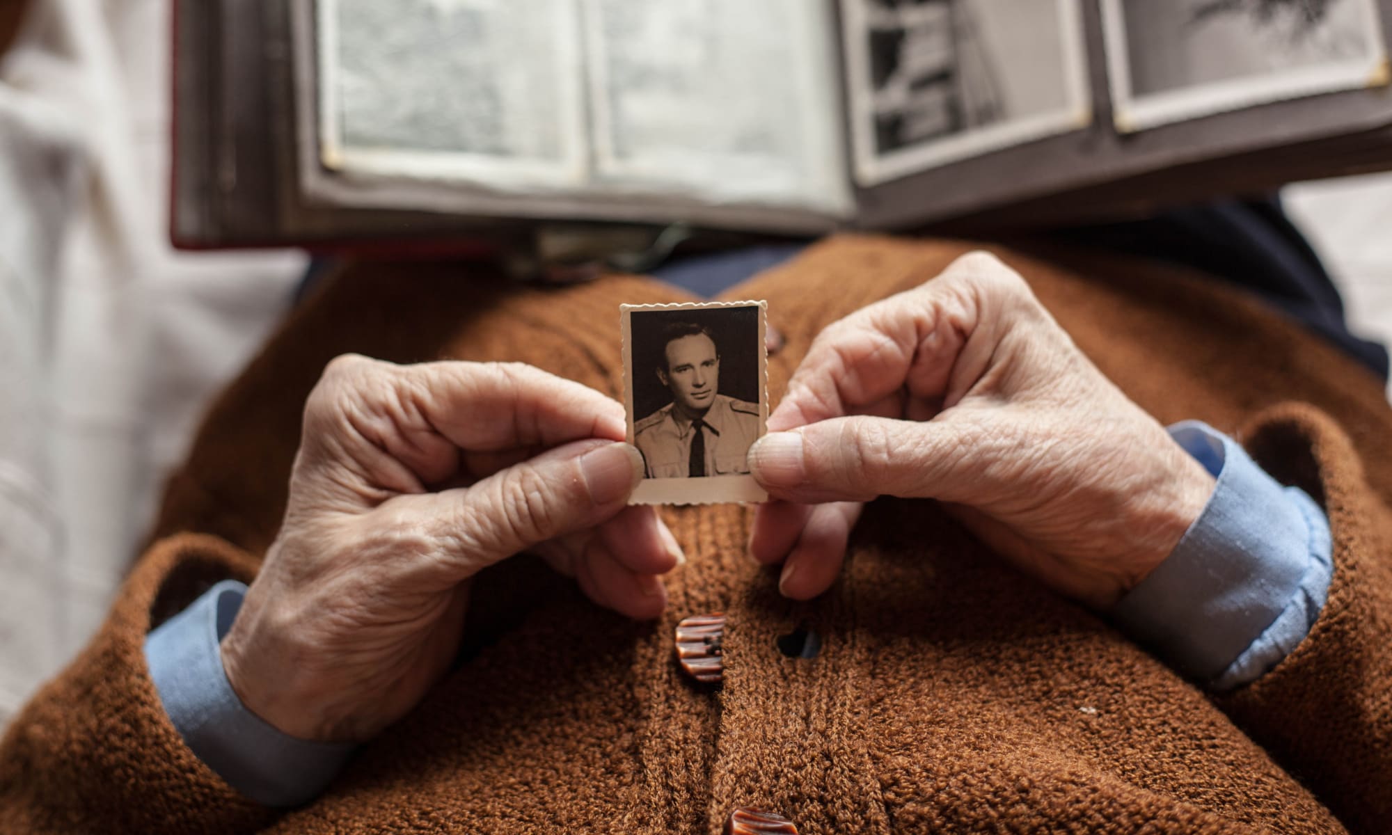 Senior resident holding a photo at Broadwell Senior Living in Plymouth, Minnesota