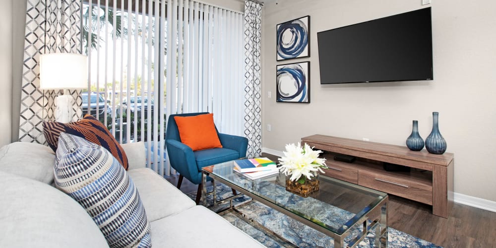 Living room with hardwood floors at The Aspect in Kissimmee, Florida