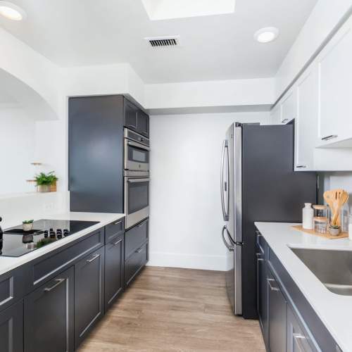 Modern apartment kitchen at 1900 Ocean Apartment Homes in Long Beach,