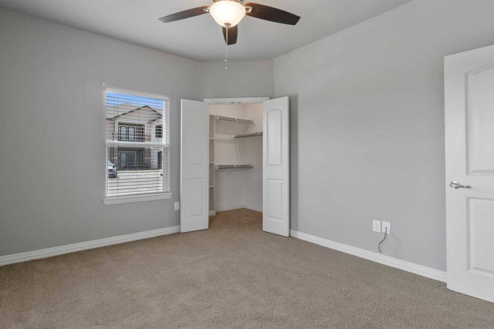 Walk-in closets in the bedroom at Pine Creek in Paris, Texas