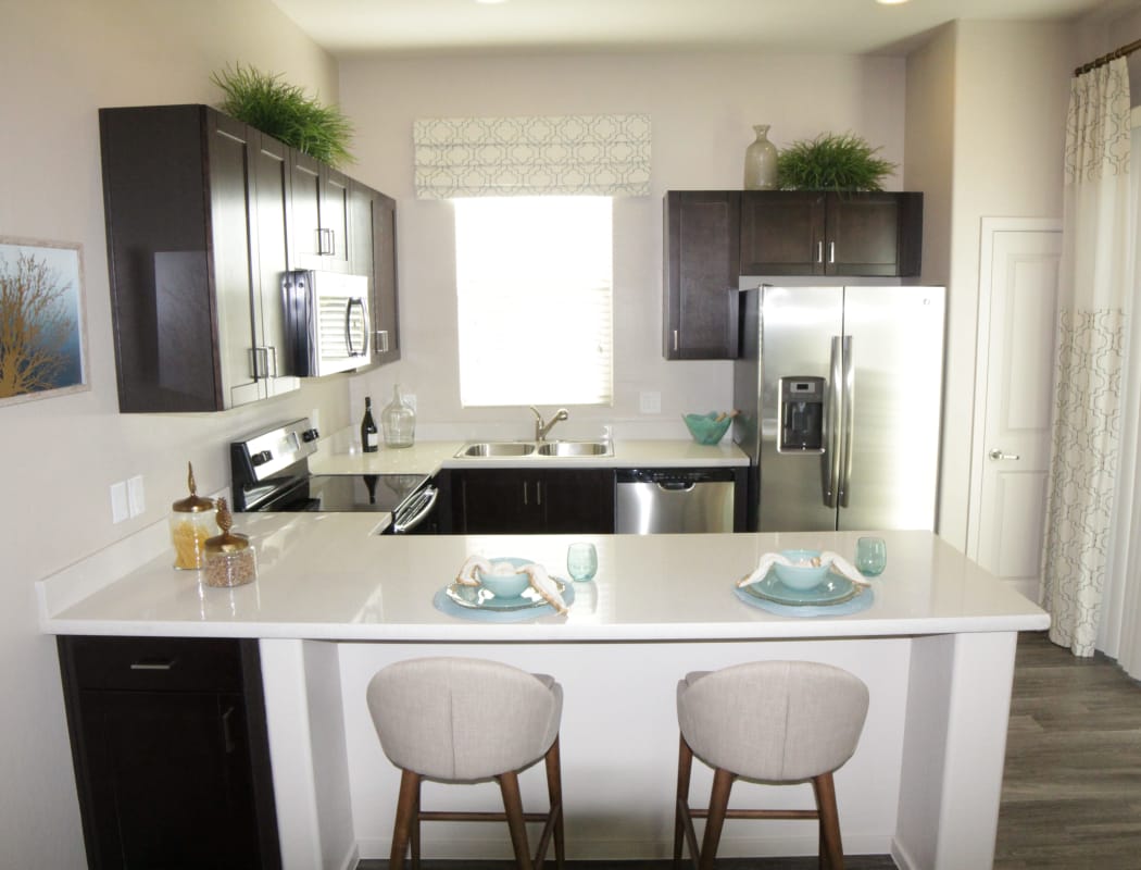 Avilla Buffalo Run showcases a beautiful kitchen with breakfast bar in Commerce City, Colorado