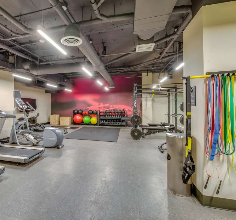 Treadmills and free weights in the fitness center at Verse Seattle in Seattle, Washington